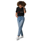 Woman wearing a black organic cotton T-shirt with red and black Revolution artwork